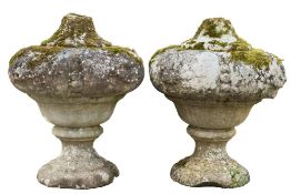 A pair of 18th Century carved stone garden urns:,