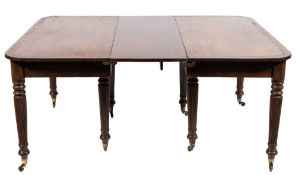 An early 19th century mahogany and inlaid dining table:, the top with rounded corners,