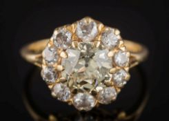 A light yellow diamond and diamond circular cluster ring:,