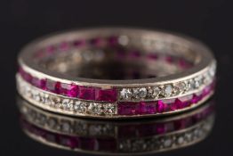 A 1930's ruby and diamond full eternity ring: with calibre-cut rubies and circular diamonds,