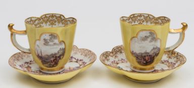 A pair of Meissen yellow-ground quatrefoil cups and saucers: painted with gilt and puce bordered