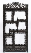 A Chinese carved ebonised hardwood open display cabinet:,