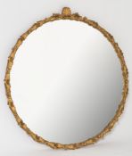 A gilt gesso framed circular mirror:, the plate within a surround decorated with flowerheadas,