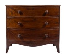 An early 19th century mahogany bow-fronted chest:, the top with a reeded edge,