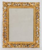 A carved giltwood Florentine frame rectangular mirror:,