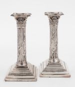 A pair of Victorian silver Corinthian column candlesticks, maker Henry Harrison, Sheffield,