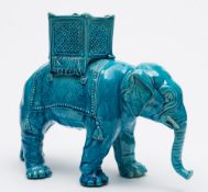 A majolica planter in the form of an elephant: modelled standing with curled trunk and supporting a