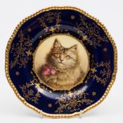 A Coalport porcelain cabinet plate: of silver shape with gilt rope edging,