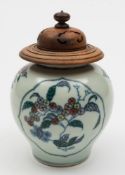 A Chinese Doucai porcelain globular jar: painted with two lotus shaped panels of fruiting peach and