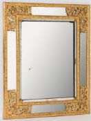 A 19th century carved giltwood and gesso rectangular marginal wall mirror:,