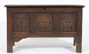 An early 18th century oak rectangular coffer: with a plain hinged moulded top,