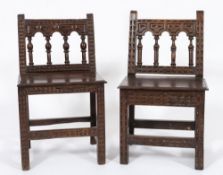 Two similar 18th century Italian carved walnut side chairs: with gouged and arcaded spindle backs