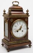 A French mahogany mantel clock: the eight-day duration movement striking the hours and half-hours