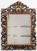 A late 19th century carved giltwood and ebonised Florentine frame wall mirror:,