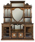 A Victorian ebonised and amboyna gilt decorated and gilt metal and porcelain mounted side cabinet:,