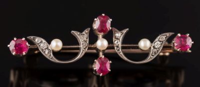 A late 19th century gold, silver, ruby and diamond bar brooch: of openwork scroll design.