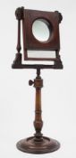 A Victorian mahogany and chequer strung zograscope: with hinged mirror plate and magnifying glass,