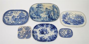 Six various transfer decorated blue and white strainers: comprising a Rogers example in the Greek