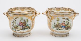 A pair of English, probably Minton 'seaux': each of footed form with foliate handles and ribbed rim,