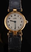 A lady's silver gilt 'Must de Cartier' quartz wristwatch: the circular dial with Arabic numerals