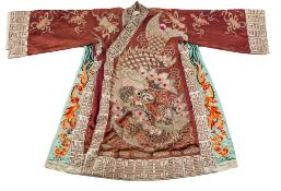A Chinese embroidered silk coat: the front and back panels decorated with stylised fish with