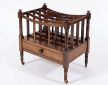 An early 19th century mahogany four-division canterbury: with curved and slatted divisions and