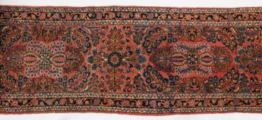 A Hamadan Runner:, the rose field with an all over design of palmettes and floral foliate sprays,