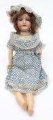 An Heubach Kopplesdorf bisque head doll:, applied wig, blue glass sleeping eyes,