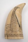 A scrimshaw decorated tooth:,