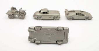 A collection of fifty pewter scale model cars by Franklin Mint, together with a display cabinet,