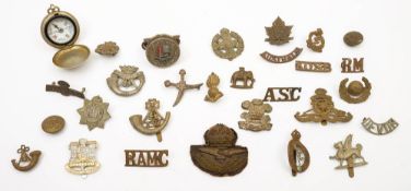 A small collection of various cap and shoulder badges together with a pocket compass:,