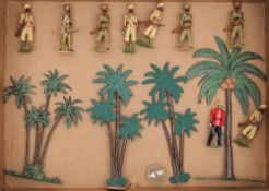 A set of hand painted Indian Frontier Force figures:, together with four palm trees.