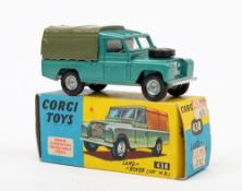 A Corgi 438 Land Rover 109:, metallic green with lemon interior, grey tilt and cast hubs,