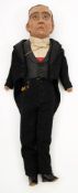 An early 20th century papier mache headed doll of a gentleman in evening dress:,