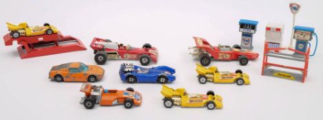 A collection of racing cars and sports cars including a Corgi Ferrari 312/B12,