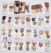A collection of various European service medals and decorations including a Belgian Resistance