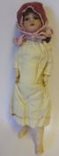A late 19th century Continental bisque head doll: impressed 3/0, with brown mohair wig,