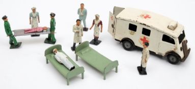 A small group of Britains hospital figures together with Tri-ang Minic clockwork ambulance:.