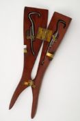 An early 20th century novelty wooden lady's leg folding boot pull:,