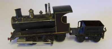 An 0 gauge 0-4-0 live steam loco: with non matching tender, possibly by Bing.