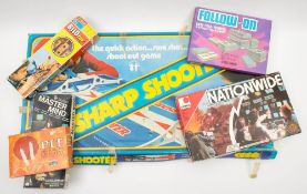 A collection of various board games and annuals: including 'Sharp Shooter', 'Formula 1',