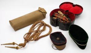 A collection of Devonshire Regiment belts, aiguillettes and uniform:.