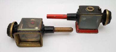 A pair of brass and overpainted carriage lamps:, of typical form with sprung candle ejectors,