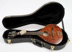 An eight string mandolin by Colin Kendall:, in a fitted case, 65cm long..