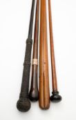 An ebony and ropework walking cane, an Edwardian silver mounted rosewood walking cane,