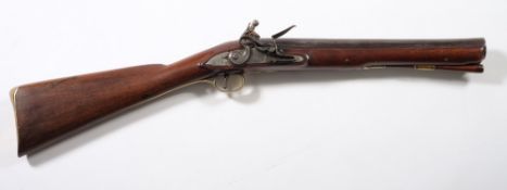 A 19th century flintlock blunderbuss:, the 15 inch barrel with flared muzzle,