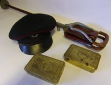 Two World War I Christmas tins: a shooting stick and a St Johns Ambulance hat.