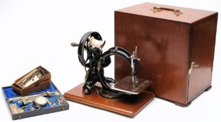 An early 20th century black lacquer and gilt 'Silent Sewing Machine' by Wilcox & Gibbs, London:,