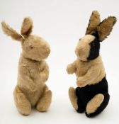 An early 20th century white plush Albino rabbit and a similar black and white plush rabbit:,