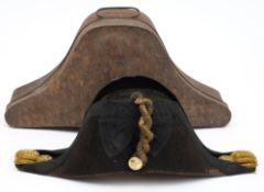 A Royal Navy bicorn hat in Russian lacquer tin:, with gilt braid and button.